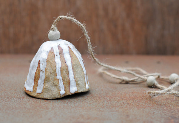 HAND PINCHED CERAMIC BELL - SANDY CLAY - WHITE DRIBBLE GLAZE