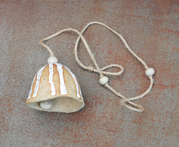 HAND PINCHED CERAMIC BELL - SANDY CLAY - WHITE DRIBBLE GLAZE